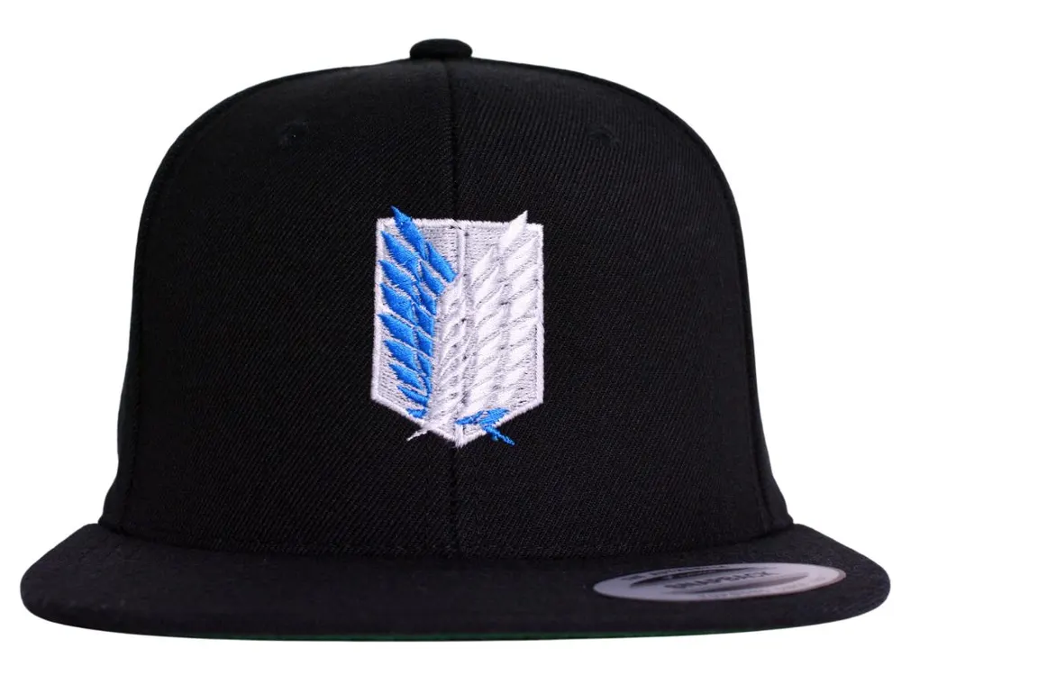 Front view of the embroidered Wings of Freedom symbol on a black snapback hat